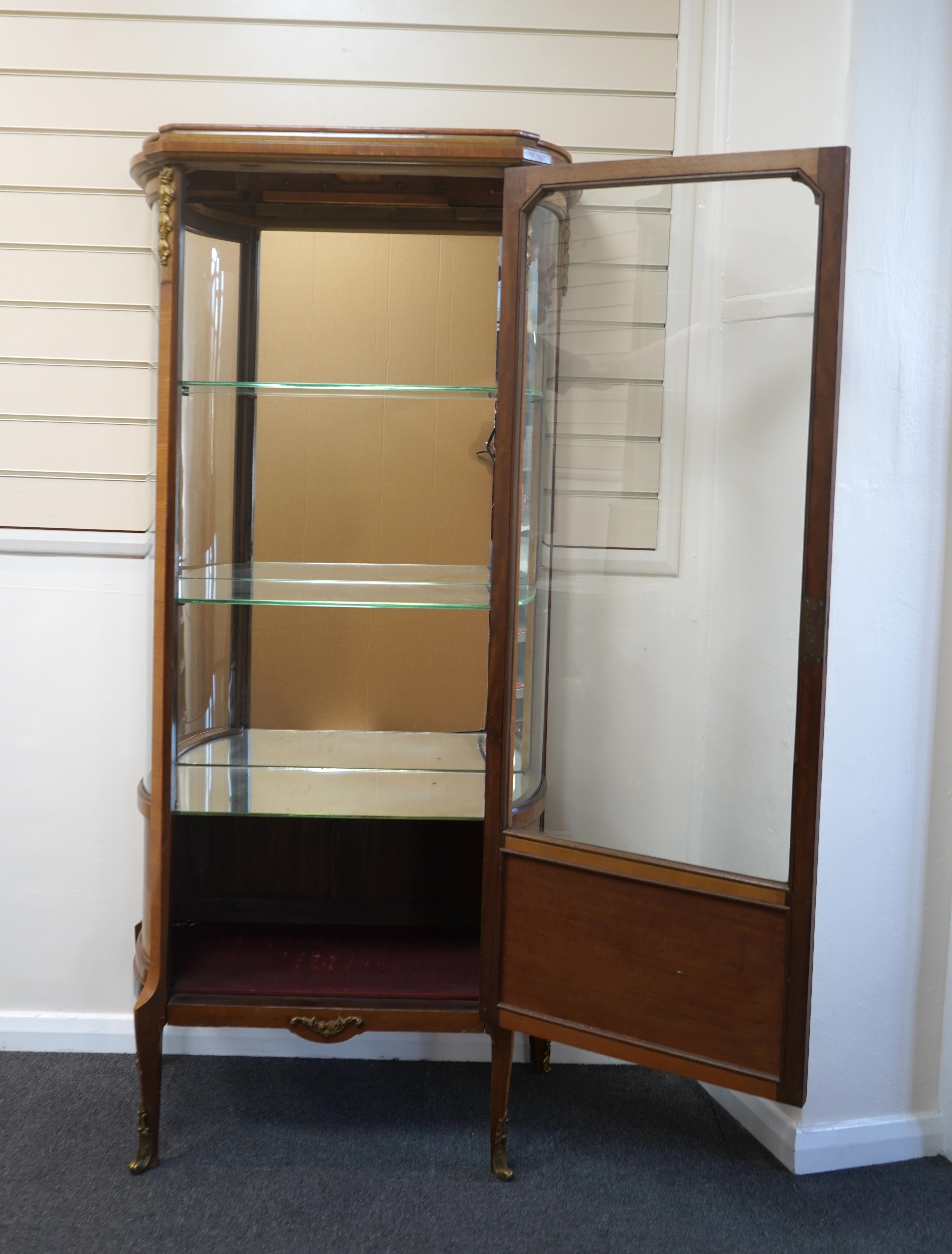 A Louis XVI style marquetry inlaid, gilt metal mounted kingwood vitrine